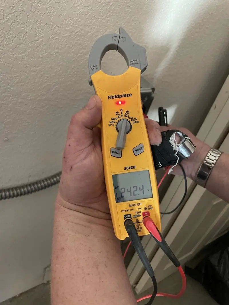 Voltage testing with clamp meter during Outlet Installation in Mount Zion